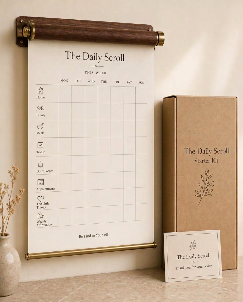 The Daily Scroll Starter Kit with kraft gift box, walnut and brass scroll holder, brass paper weight, and mounting hardware